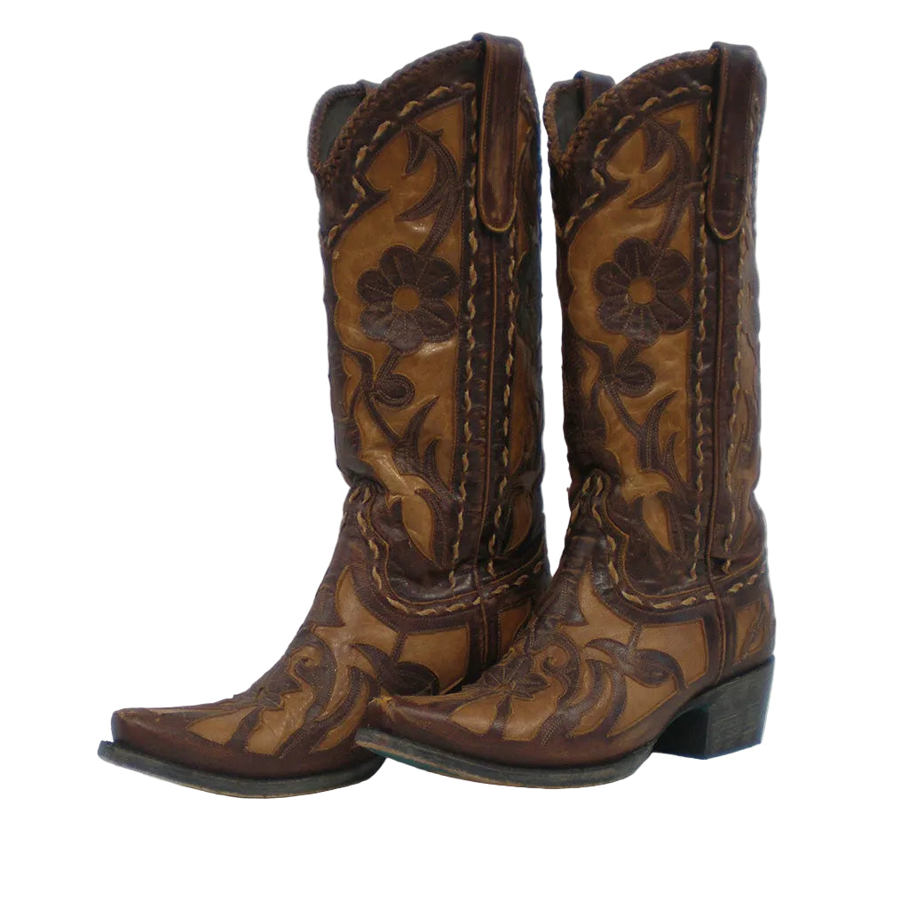 A pair of brown leather cowboy boots with dark brown floral tooling and stitching, shown against a plain light gray background.