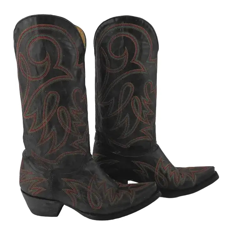 A pair of black leather cowboy boots with reddish-brown western-style embroidered detailing, shown against a neutral gray background.