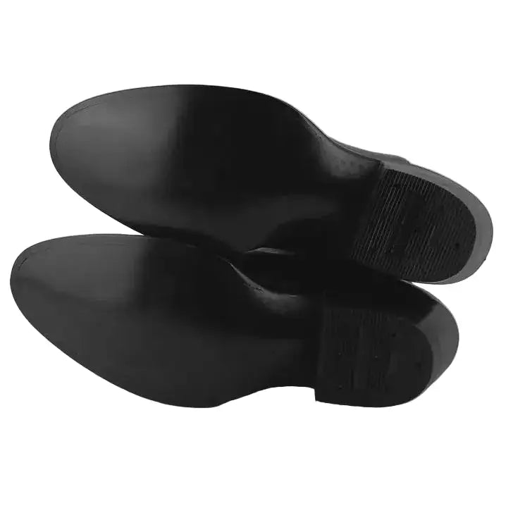 A pair of black dress shoes shown from the sole side, photographed on a plain light gray background.