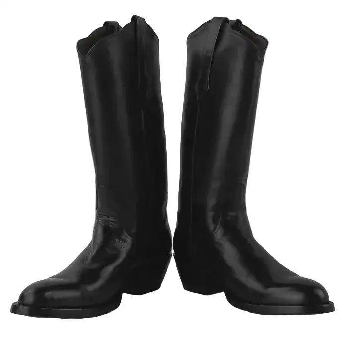 A pair of black leather cowboy boots with a pointed toe and low block heel, photographed against a neutral gray background.