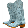 Light blue cowboy boots with brown soles on a white background